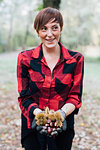 Woman with handful of chestnuts