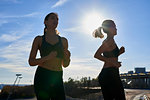 Friends jogging in sports stadium