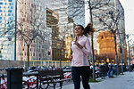 Woman jogging on sidewalk, Barcelona, Catalonia, Spain