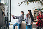 Friends celebrating with champagne in loft office