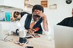 Businessman using smartphone in loft office