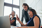 Businesswomen using smartphone and working in loft office