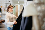 Woman shopping in fashion boutique