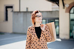 Female shopper sightseeing in piazza, Arezzo, Toscana, Italy