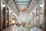 Senior businessman using digital tablet inside office building, Milano, Lombardia, Italy