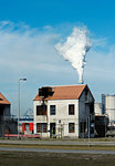 House used for training firefighters, smoke from coal fired power station in background, Maasvlakte, Rotterdam, Zuid-Holland, Netherlands