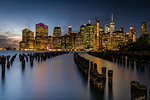 Long exposure of the lights of Lower Manhattan during the evening blue hour as seen from Brooklyn Bridge Park, New York, United States of America, North America