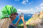 A tourist takes a photo with smartphone, Nebida, Iglesias, Sud Sardegna province, Sardinia, Italy, Mediterranean, Europe