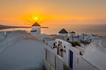 View of windmills at sunset in Oia village, Santorini, Cyclades, Aegean Islands, Greek Islands, Greece, Europe