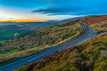 Light trails on road through Peak District National Park, England, Europe