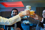 Business people toasting drink at bar