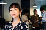 Serious businesswoman standing in office