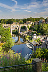Rowing boats and viaduct over the River Nidd in lower Nidderdale on a mid-summer sunny day, Knaresborough, Borough of Harrogate, North Yorkshire, England, United Kingdom, Europe