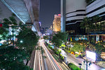 View of elevated skytrain track and traffic light trails on Sukhumvit Road in downtown Bangkok, Thailand, Southeast Asia, Asia