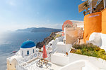 View of blue domed church from cafe in Oia village, Santorini, Cyclades, Aegean Islands, Greek Islands, Greece, Europe