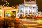 View of Burgtheater and city trams at night in Rathausplaza, Vienna, Austria, Europe