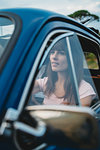 Woman behind steering wheel