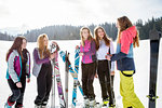 Five teenage girl skiers chatting in snow covered landscape, Tyrol, Styria, Austria