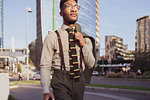 Businessman walking in city, Milano, Lombardia, Italy