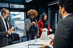 Business partners having tea break at meeting in office