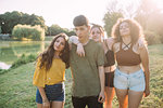 Friends posing by lake