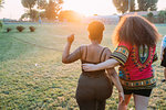 Friends walking in park