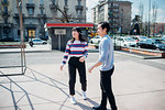 Young man and woman on city basketball court