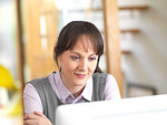 Woman viewing reports on a computer