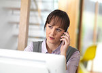 Woman talking through a business issue over the phone