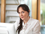 Woman taking a moment and having a think during her working day in the office