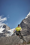 Mountain biker jumping, Saas-Fee, Valais, Switzerland