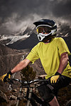 Portrait of mountain biker wearing helmet, Saas-Fee, Valais, Switzerland