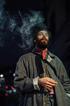 Bearded young man loitering on street