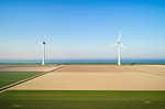 Coastal wind turbines and field landscape in spring, elevated view, Urk, Flevoland, Netherlands