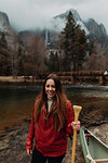 Young female canoeist on riverbank, portrait, Yosemite Village, California, USA