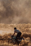 Motorbiker raising dust, Kennedy Meadows, California, US