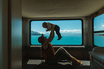 Mother playing with baby in motorhome, Wanaka, Taranaki, New Zealand