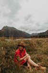 Woman exploring wilderness by lake, Queenstown, Canterbury, New Zealand