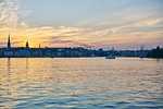 Skyline of old town by sea at sunset in Stockholm, Sweden