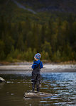 Boy fishing in river