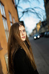 Portrait of young woman in city street in Stockholm, Sweden