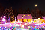 Christmas lights in snow covered front yard