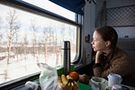 Woman sitting at table on train