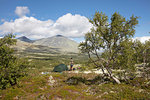 Man by his tent in Rondane National Park, Norway