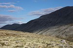 Man standing by hill in Rondane National Park, Norway
