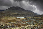 Lake by mountain in Rondane National Park, Norway