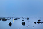 Lange Jan Lighthouse seen through fog in Oland, Sweden