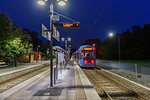 Train arriving at station at night in Lidingo, Sweden