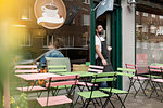 Small business owner outside his cafe