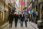 Couple holding hands on street in Stockholm, Sweden